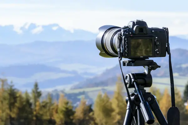 DSLR camera pointed towards landscape